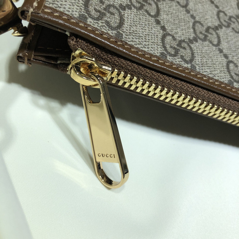 G*u*i clutch bag